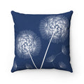 A square-shaped throw pillow with a blue background featuring a white dandelion print. This pillow features different designs on each side.