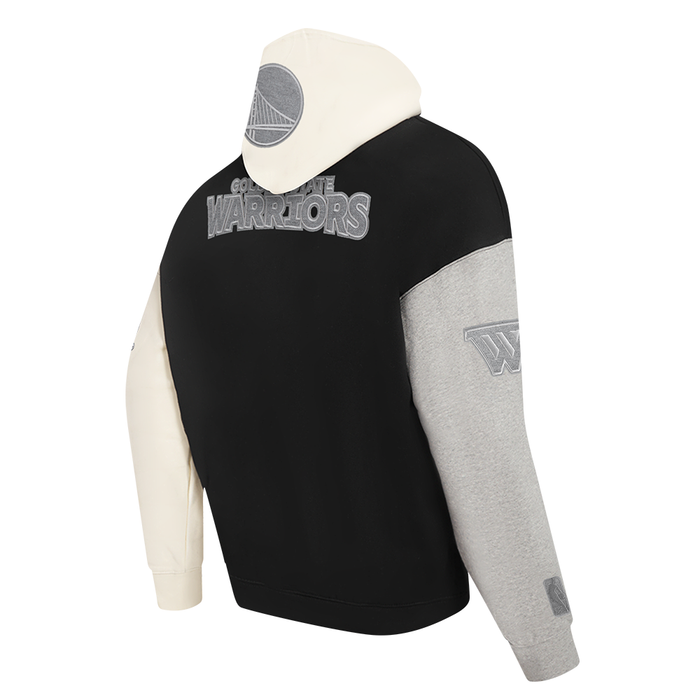 The hoodie laid flat displaying the combination of black, grey, and eggshell sections with the Golden State Warriors branding
