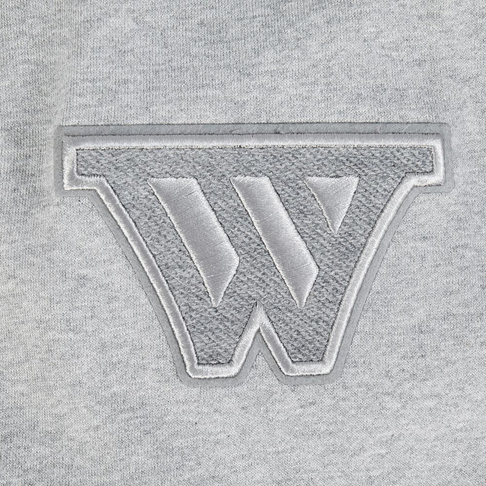 Full-length view of the pullover hoodie showcasing the relaxed fit and color palette of black, grey, and eggshell